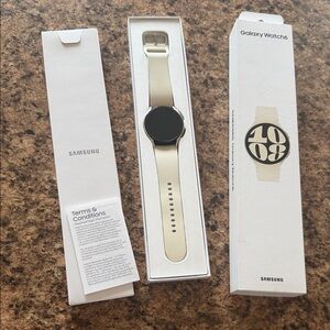 Samsung Galaxy Watch 6 — Champagne/Beige Silicone Strap. Works great, like new!